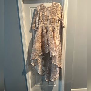 Beige high low dress.